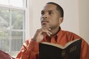 Man holding Holy Bible